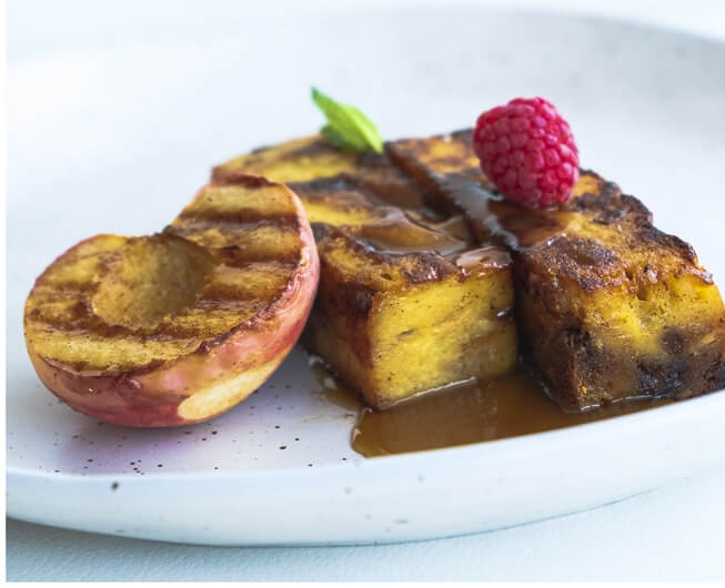 Panettone French Toast with Grilled Peaches and Caramel Sauce